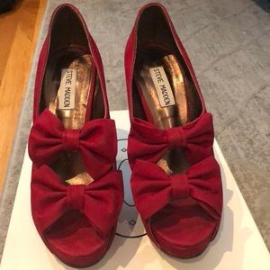 Red nubuck heels with bows